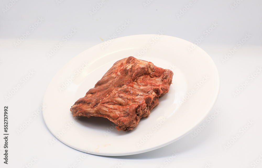 Fried pork ribs, barbecue, put in a white plate Fried pork ribs, barbecue, put in a white plate
