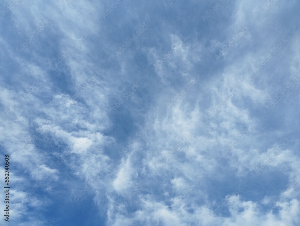 Clouds developing into a storm on a blue sky background
