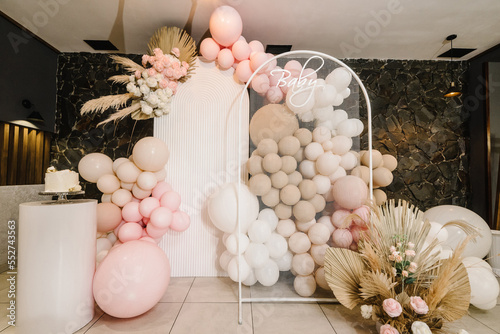 Birthday Cake on a background balloons party decor. Baby shower party, decor. Celebration baptism concept. Copy space. Celebration concept. Trendy Cake. Delicious reception. photo
