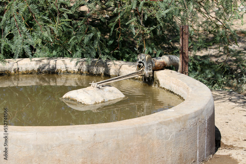 Cement water reservoir for sheep to drink at on a remote farm in Bushmanland, South Africa