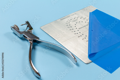 Dental hole punch, the rubber dam and the metal plate