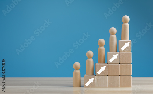 Fotografía wooden doll laying on Stairs of wooden blocks, Personnel management, appointing