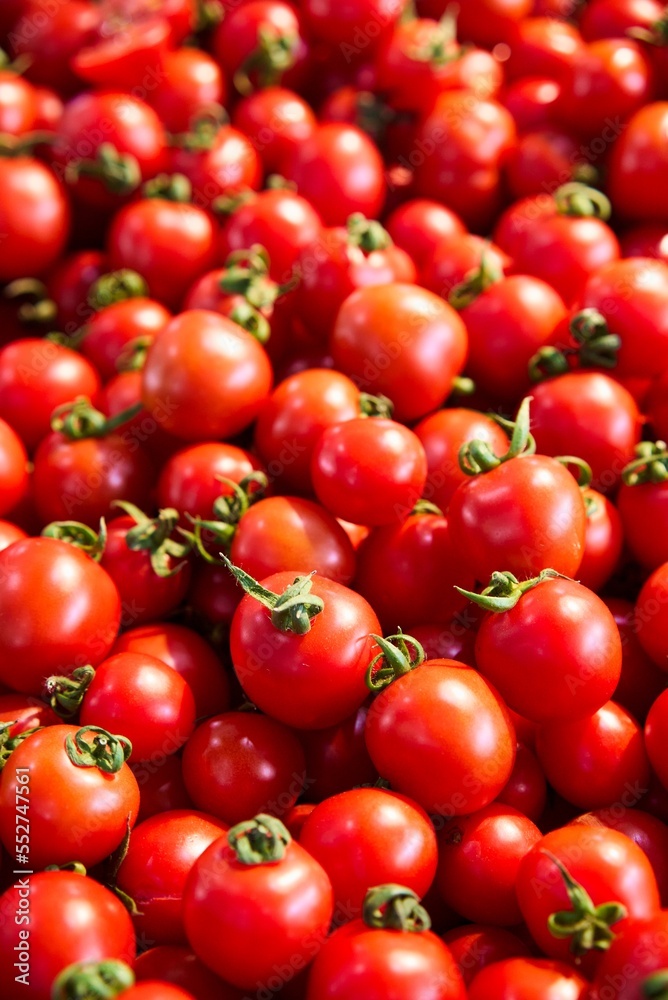 raw tomatoes on market show window. High quality photo
