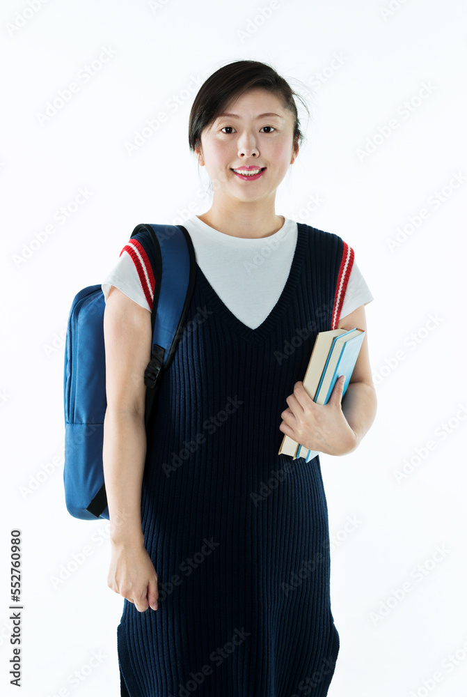 College girl holding bag and books isolated on white background College girl holding bag and books isolated on white background