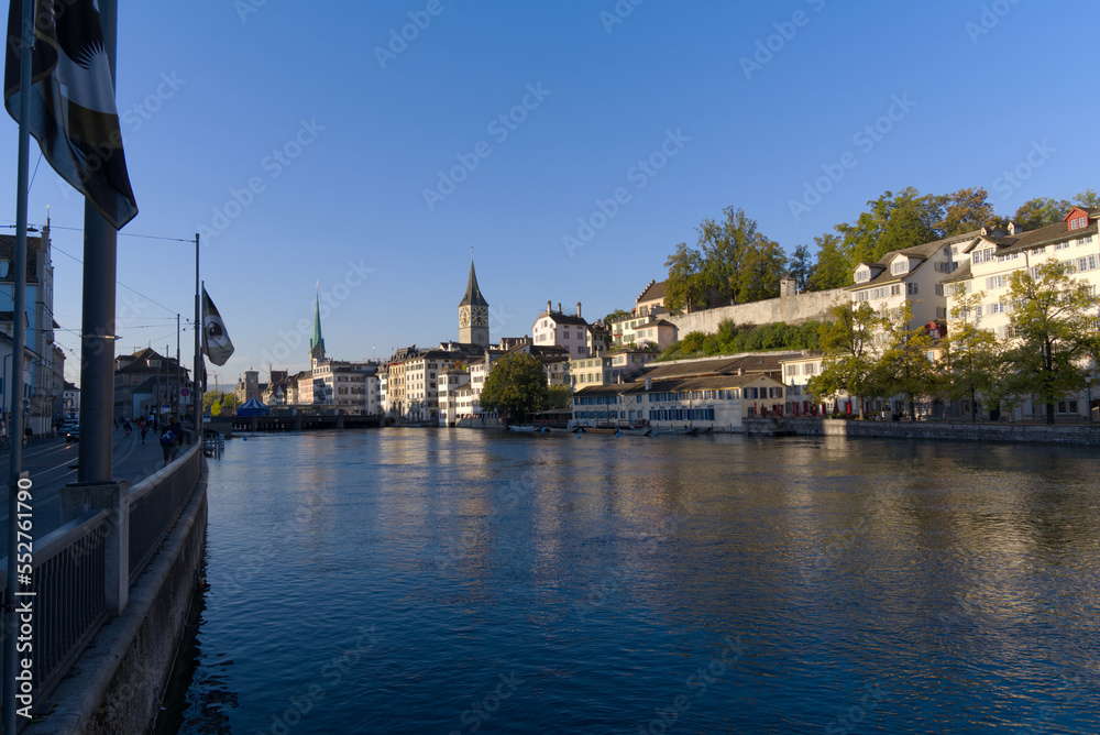 Beautiful cityscape of the old town of Zürich with church towers and Limmat River in the foreground on a sunny late summer morning. Photo taken September 22nd, 2022, Zurich, Switzerland. Beautiful cityscape of the old town of Zürich with church towers and Limmat River in the foreground on a sunny late summer morning. Photo taken September 22nd, 2022, Zurich, Switzerland.