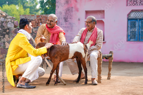 Indian villagers talking of goat farming out of home.
