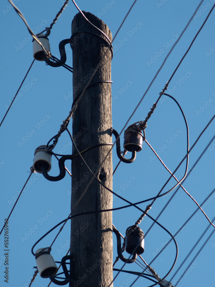 Obraz premium power line. electric pole with wires. old wooden electric pole