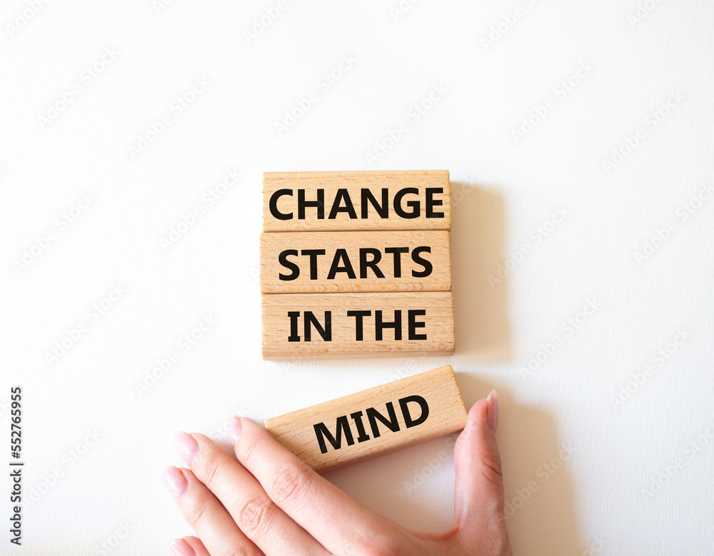 Change starts in the mind symbol. Concept words Change starts in the mind on wooden blocks. Beautiful white background. Businessman hand. Business and Change starts in the mind concept. Copy space Change starts in the mind symbol. Concept words Change starts in the mind on wooden blocks. Beautiful white background. Businessman hand. Business and Change starts in the mind concept. Copy space