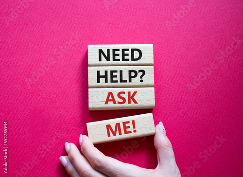 Need help ask me symbol. Concept words Need help ask me on wooden blocks. Beautiful red background. Businessman hand. Business and Need help ask me concept. Copy space