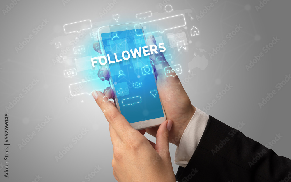 Hand using smartphone with social media concept Hand using smartphone with social media concept