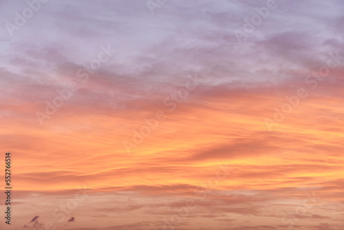 Sunset. Heaven, orange sky. Sun rays. Wallpaper. Clouds