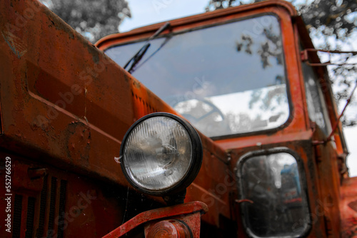 Details of an old, retro red tractor