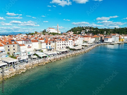 Waterfront Piran town in Slovenia on sunny day drone aerial view