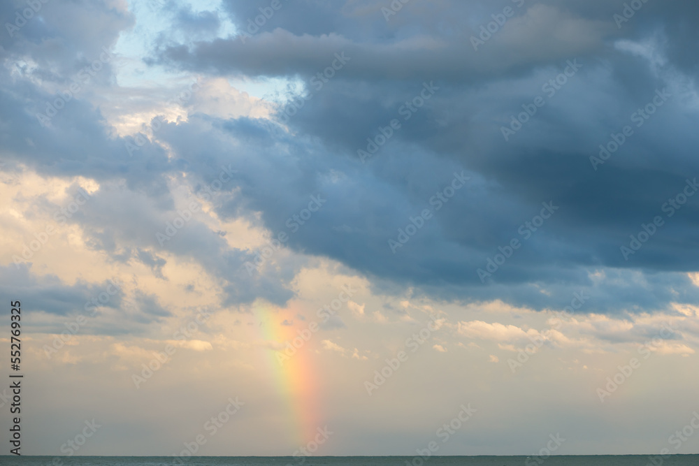 rainbow on the sea in cloudy weather