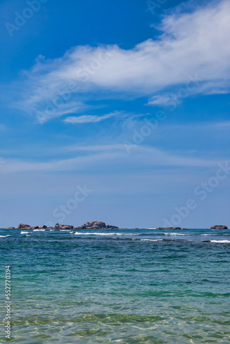 Tropical nature landscape with azure sea, backdrop amazing seascape, background of Indian ocean on coastline, Sri Lanka. Summer vacation travel concept. Wallpaper of tropic sea. Copy text space © Alex Vog