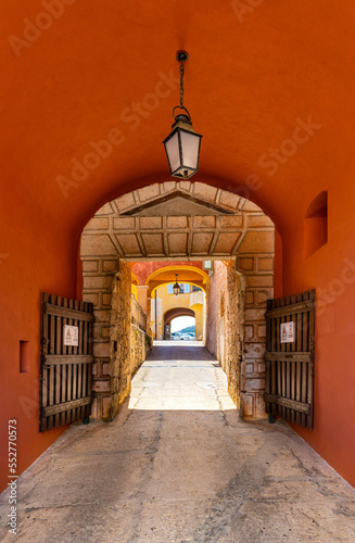 Main gate and defense walls of XVI century Citadel castle in historic old town of Villefranche-sur-Mer resort town in France