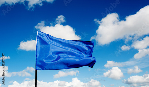 Blue flag waving on sky