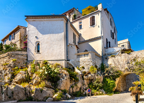 Medieval stone defense tower house at Rue Barque en Cannes street in historic old town of Antibes resort city onshore Azure Cost of Mediterranean Sea in France photo