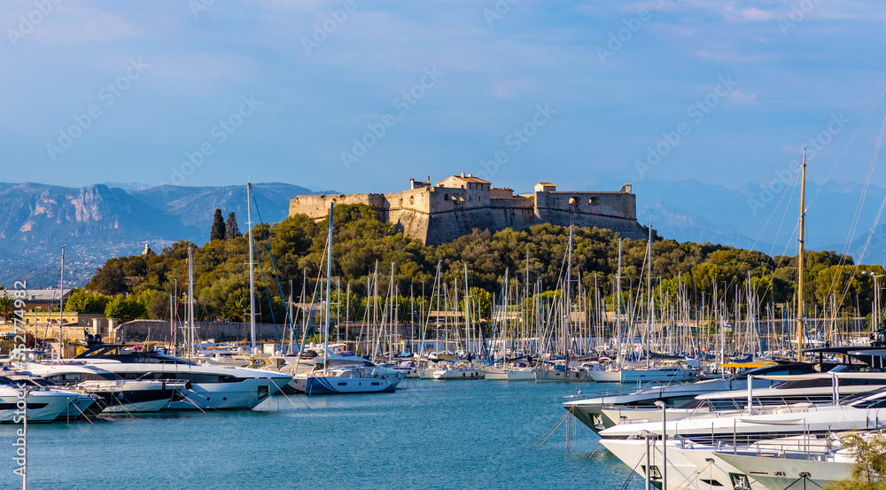 Panoramic view of harbor, port and yacht marina and Fort Carre castle offshore Azure Cost of Mediterranean Sea in Antibes resort town in France