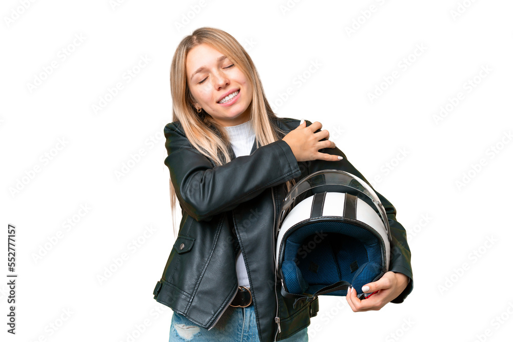 Young pretty blonde woman with a motorcycle helmet over isolated chroma key background suffering from pain in shoulder for having made an effort Young pretty blonde woman with a motorcycle helmet over isolated chroma key background suffering from pain in shoulder for having made an effort