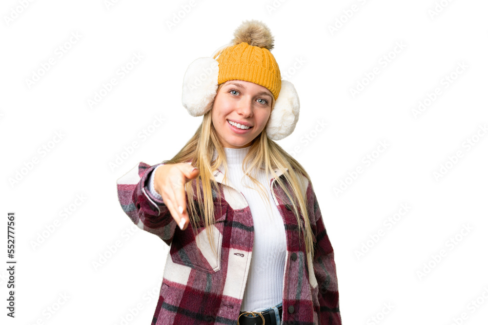 Young pretty blonde woman wearing winter muffs over isolated chroma key background shaking hands for closing a good deal Young pretty blonde woman wearing winter muffs over isolated chroma key background shaking hands for closing a good deal