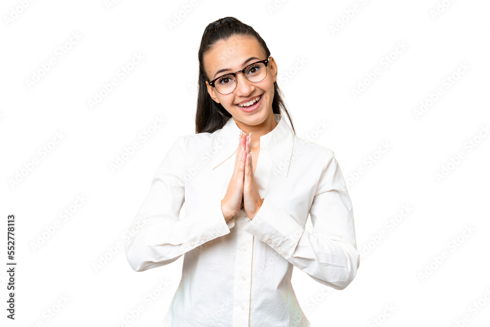 Young Arabian woman over isolated chroma key background keeps palm together. Person asks for something Young Arabian woman over isolated chroma key background keeps palm together. Person asks for something