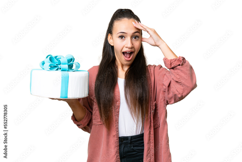 Young Arabian woman holding birthday cake over isolated chroma key background with surprise expression Young Arabian woman holding birthday cake over isolated chroma key background with surprise expression