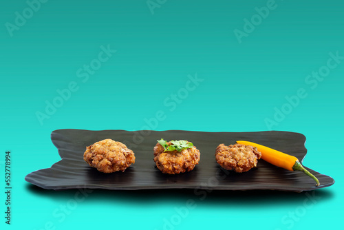 Fried Pork Balls with Garlic on black plate