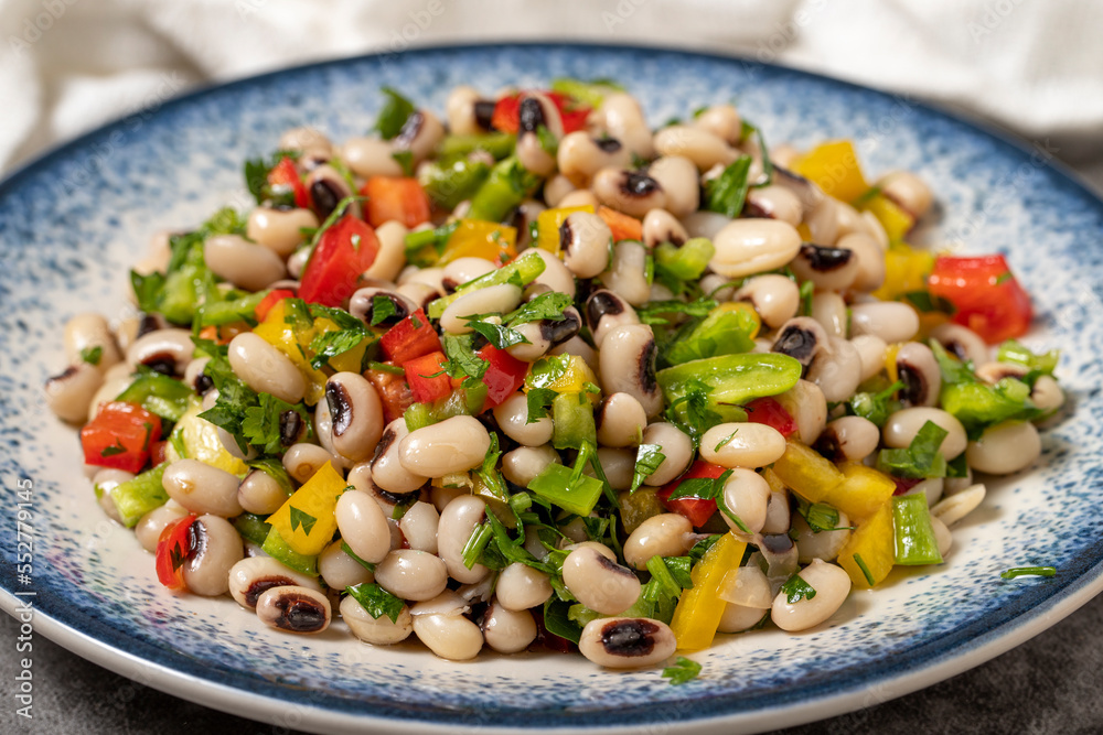 Dried cowpea salad on a dark background. Turkish cuisine appetizer flavors. close up Dried cowpea salad on a dark background. Turkish cuisine appetizer flavors. close up