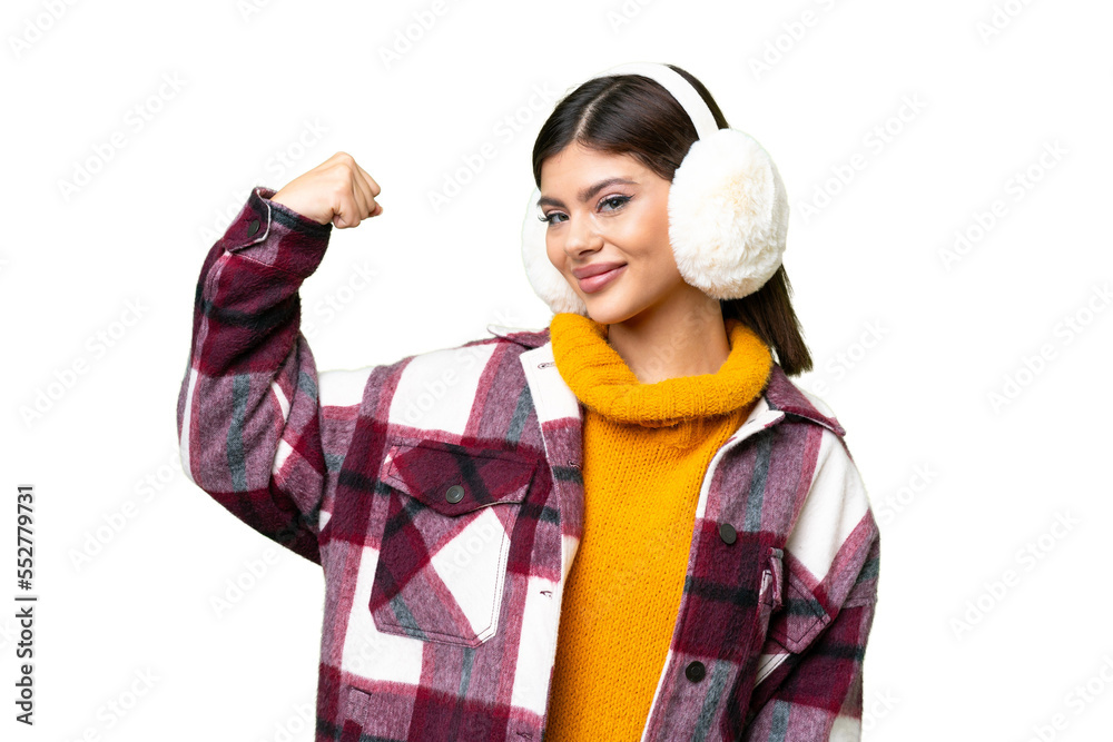 Young Russian woman wearing winter muffs over isolated chroma key background doing strong gesture Young Russian woman wearing winter muffs over isolated chroma key background doing strong gesture