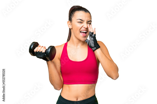 Young sport woman making weightlifting shouting with mouth wide open