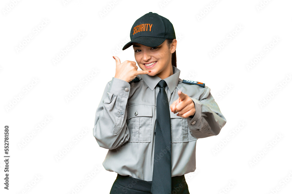 Young safeguard woman over isolated chroma key background making phone gesture and pointing front Young safeguard woman over isolated chroma key background making phone gesture and pointing front