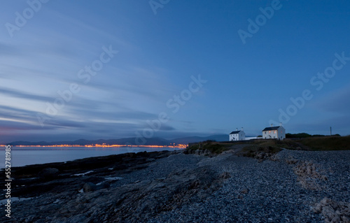 two lighthouse cottages on black point Penmon Anglsea north wales during dawn, photo