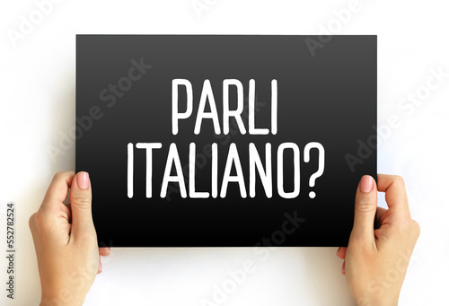Parli Italiano? (do you speak Italian?) text on card, concept background photo