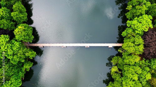 Aerial view of the old town aerial view over green forest with river in the morning. summer background of Lubniewice, poland.