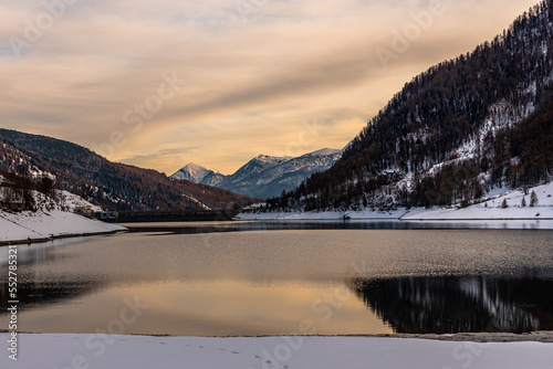 L’inverno in Valle Varaita: il lago di Pontechianale, la neve ed il ghiaccio sugli alberi photo