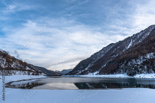 L’inverno in Valle Varaita: il lago di Pontechianale, la neve ed il ghiaccio sugli alberi photo
