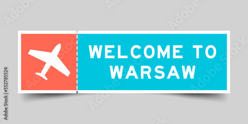 Orange and blue color ticket with plane icon and word welcome to warsaw on gray background