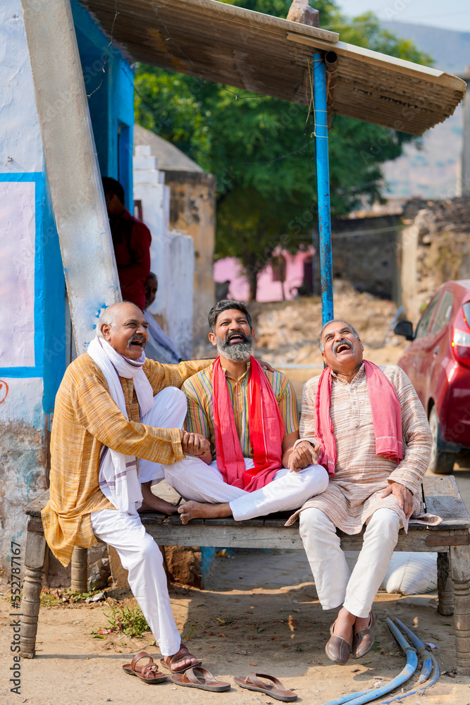 Happy indian villagers talking and smiling at home - obrazy, fototapety, plakaty 