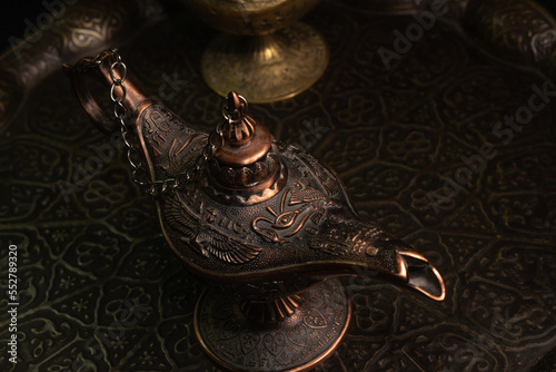 Aladdin's magic lamp isolated on black background