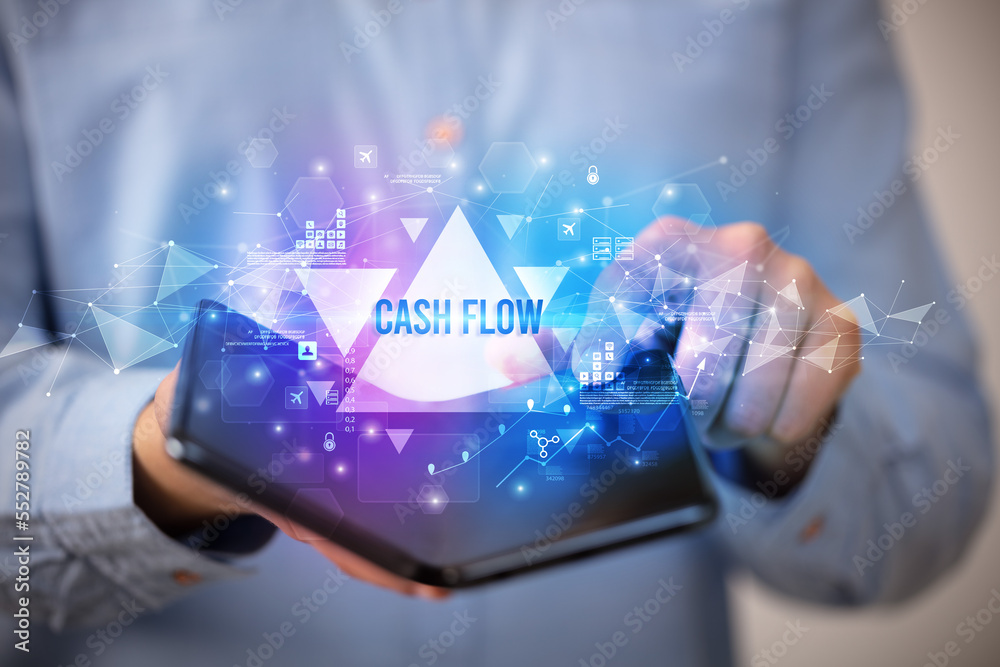 Businessman holding a foldable smartphone, business concept Businessman holding a foldable smartphone, business concept