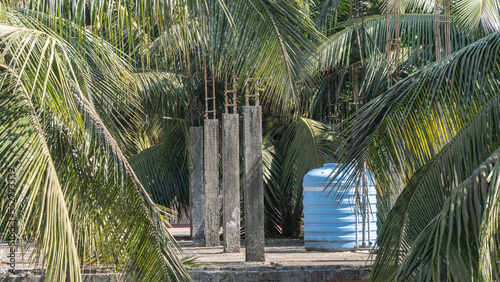 Photography Water tank filler on the roof of an unfinished house, water supply
