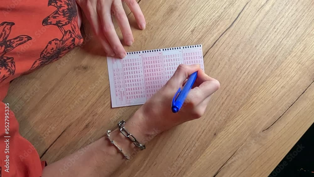 Picking lotto numbers.
Lottery playing cards. A woman's hand crosses out the numbers.
Picking lotto numbers.
Lottery playing cards. A woman's hand crosses out the numbers.