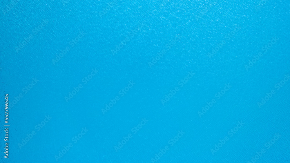 Top view of the turquoise surface of the lake water. A small ripple from the waves and a slight gradient from light blue to dark blue. Photo as a background. Clean water. Kolsai Lake, Kazakhstan