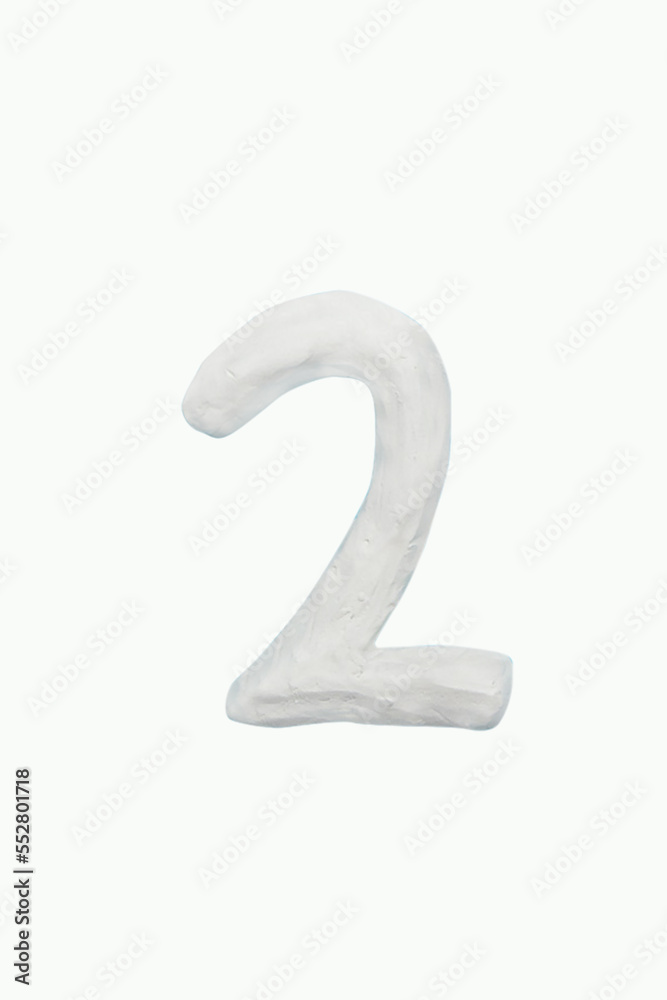 Plasticine handmade color white arabic number Two. Isolated on white background. it is a universal language used all over world. For kids, children math operation to enhance brain skills. Plasticine handmade color white arabic number Two. Isolated on white background. it is a universal language used all over world. For kids, children math operation to enhance brain skills.