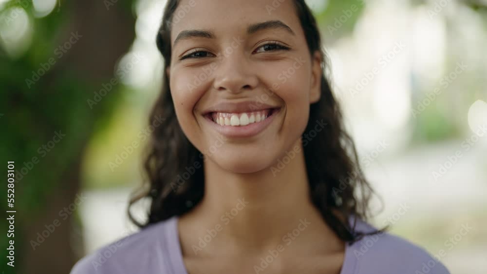 Young african american woman smiling confident standing at street Young african american woman smiling confident standing at street