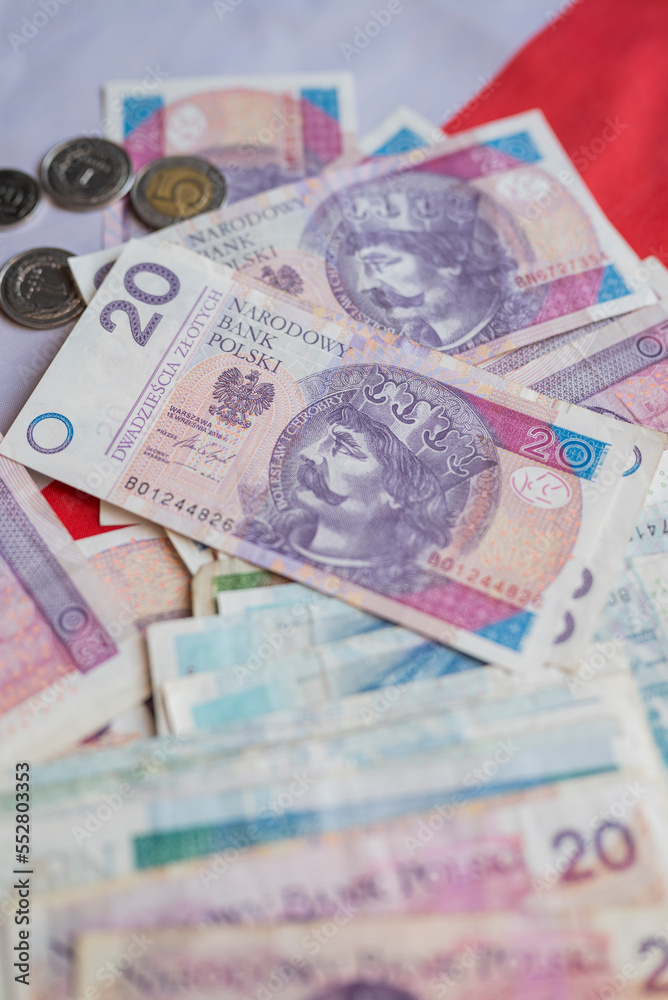 Polish money zloty banknotes on the Polish flag Polish money zloty banknotes on the Polish flag