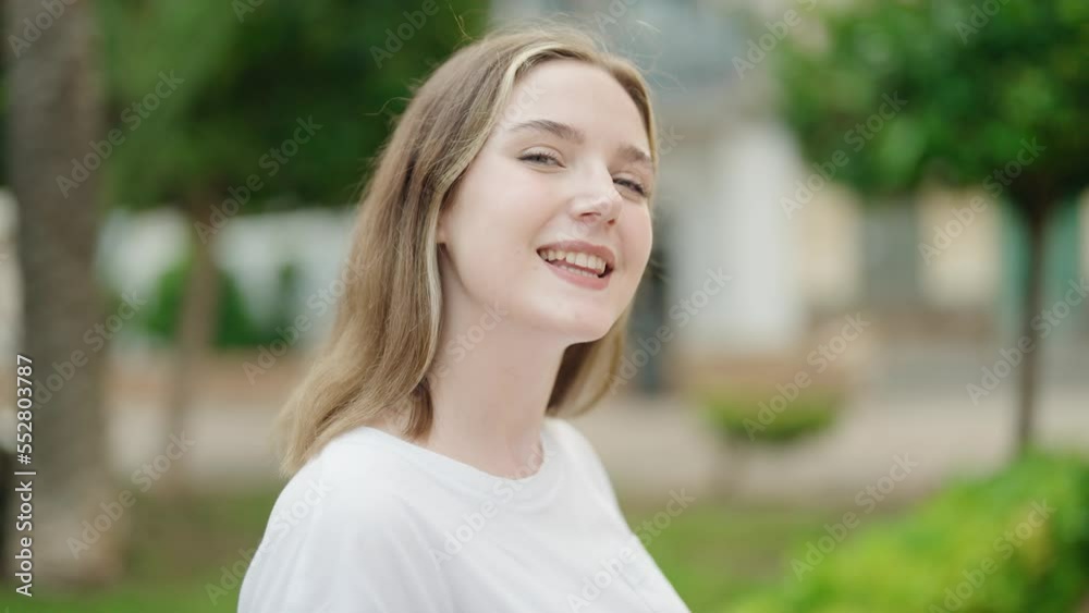 Young caucasian woman smiling confident standing at park Young caucasian woman smiling confident standing at park