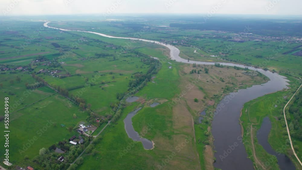 River water stream on summer greenery landscape Warta river in Poland River water stream on summer greenery landscape Warta river in Poland