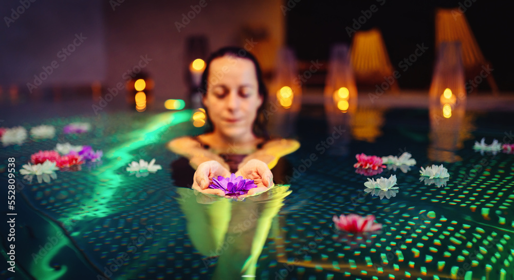 Woman and beautiful flowers in swimming pool. Woman and beautiful flowers in swimming pool.
